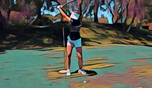 Golfer at the top of the backswing with an alignment rod standing just outside the trail hip
