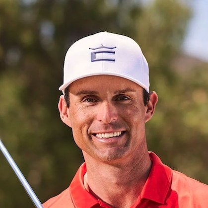 Chris Mayson, PGA Tour instructor, wearing a white cap and red polo